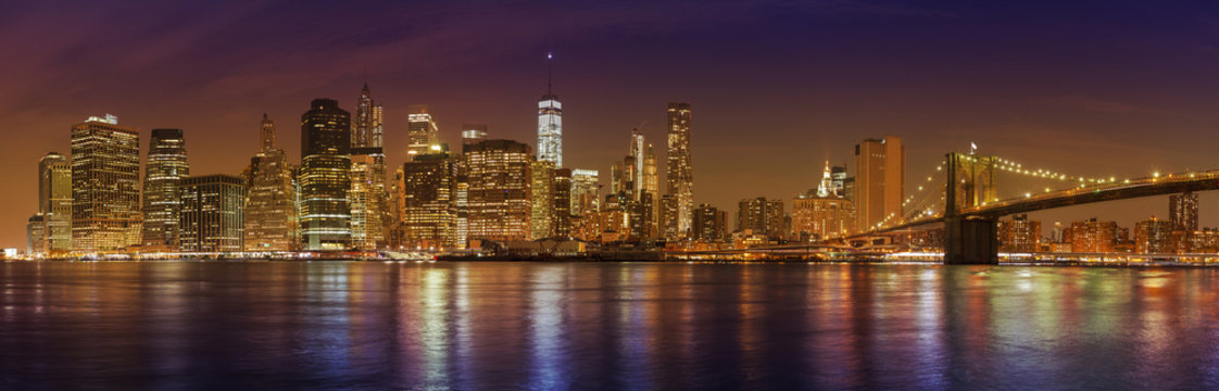 Fototapeta Manhattan skyline at night, New York City panoramic picture, USA
