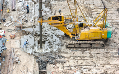 hydraulic drilling machines and workers on construction site