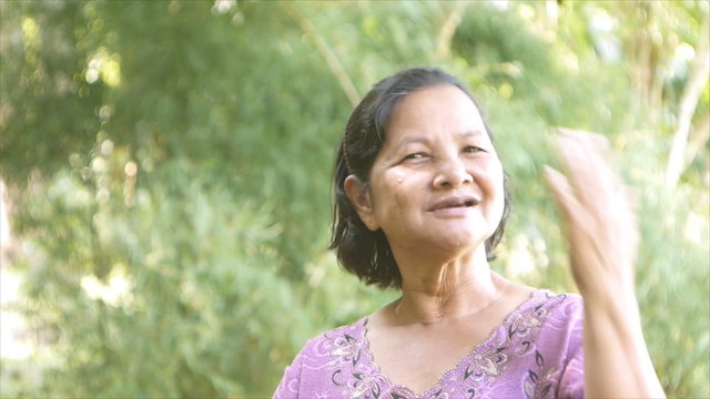 60 years old asian woman in garden