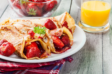 Traditional crepes served with strawberries