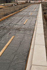 Vorarbeiten für ein Betonfundament für eine Busspur