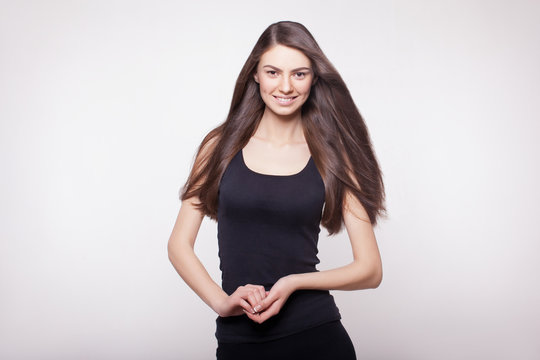 snapshot of smiling long hair model in studio