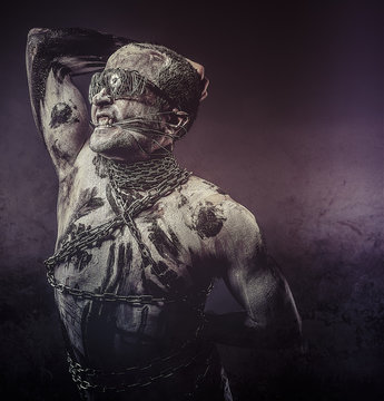 Chains, concept bdsm, slave and master, naked man
