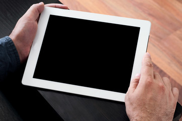 man holding a tablet computer with a blank screen closeup