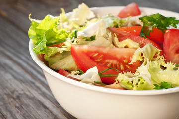 vegetable salad in a ceramic white plate