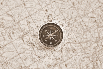 Fototapeta na wymiar Navigation: compass and a map.