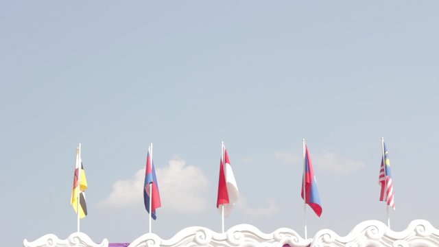 national flags of Southeast asia countries ( ASEAN ) waving atop, blue sky background