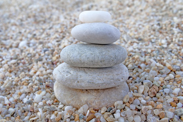Fototapeta na wymiar Stack of zen stones on beach background
