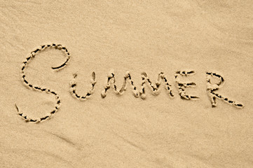 Summer inscription on the sand