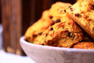 scones with cranberries shot close-up with blurry background cropped from the right