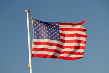American flag under a very blue sky