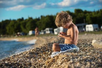 Little boy playing with smart phone