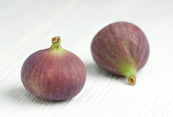 figs on white wooden background