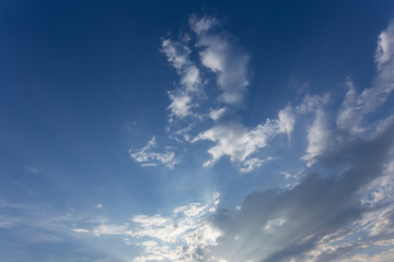 light of sunbeam on blue sky background with clouds and sunlight