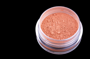 Crumbly powder isolated on black