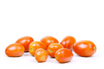 Ripe tomatoes closeup on white background