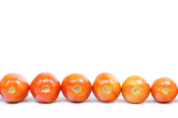 Ripe tomatoes closeup on white background