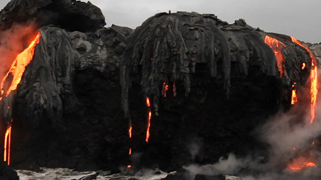 Spectacular dusk lava flow from a volcano into ocean suggest birth of planet.
