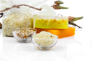 Spa still life with bath salt, soap on white background
