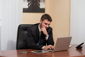 Businessman On A Break With His Computer