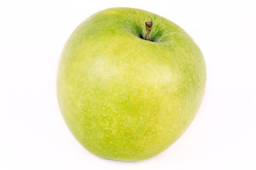 Green apple on white, closeup