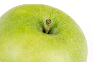 Green apple on white, closeup