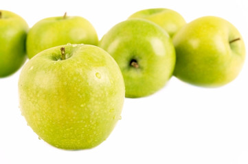 Green apple on white, closeup