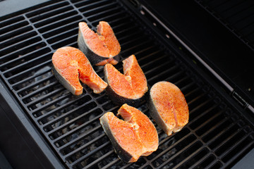 Salmon fish roast on barbecue grill.