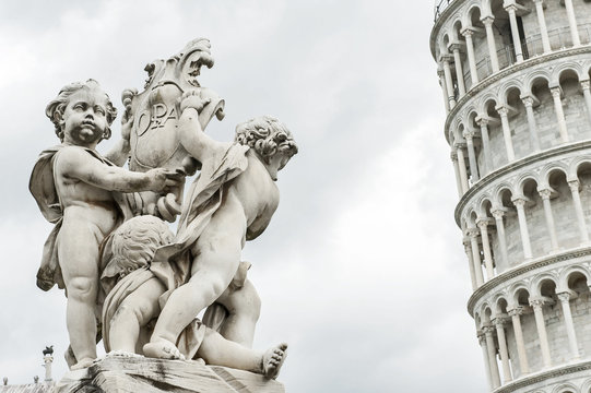 Angels Statue and leaning tower of pisa