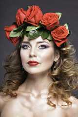Naklejka premium pretty girl's studio portrait with red roses