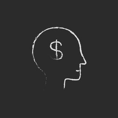 Head with dollar symbol icon drawn in chalk.