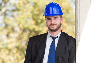 Portrait Of Happy Young Foreman With Hard Hat