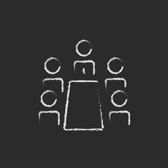 Business meeting icon drawn in chalk.