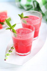 Fresh watermelon juice in the glass on wooden table
