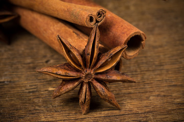 Close up of cinnamon sticks and star anise on wood