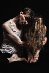 Young man hugging a woman