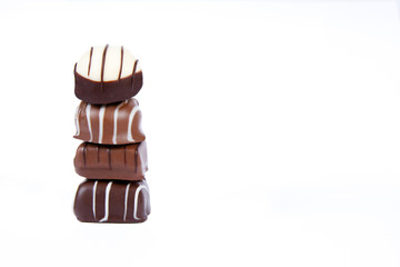 Stack of fine dark, milk and white chocolates