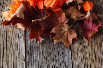 Fall leaves on rustic wood table