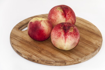 Bald peaches on the cutting board