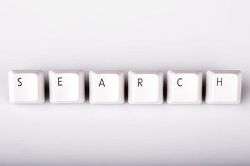 text search formed with computer keyboard keys on white backgrou