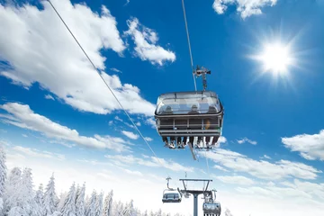 Afwasbaar fotobehang Skier sitting at ski lift © Jag_cz
