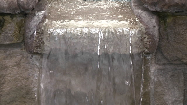 Tilt down of water in a fountain in Oak View, California.
