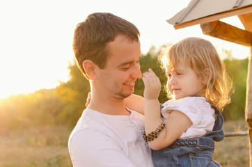 Fototapeta premium Dad and daughter in sunlight
