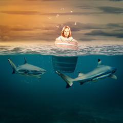 woman floating in a barrel surrounded by sharks