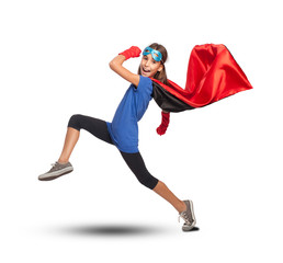 little girl wearing a superhero costume on white background