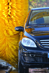 Car going through an automated car wash machine