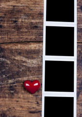 Heart and photo frame on old wooden desk