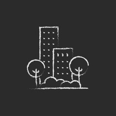 Residential building with trees icon drawn in chalk.