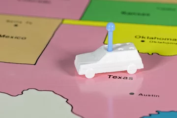 Foto op Plexiglas Toy car on a map of texas © knowlesgallery