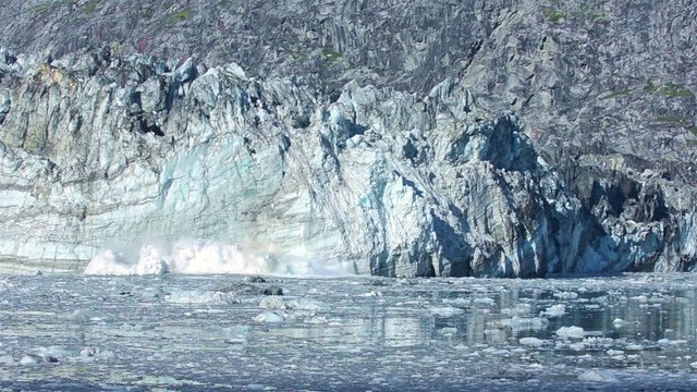 Tidewater Johns Hopkins glacier calving in Glacier Bay National Park, Alaska.